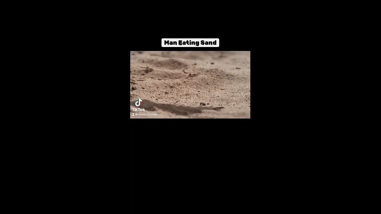 Man eating sand