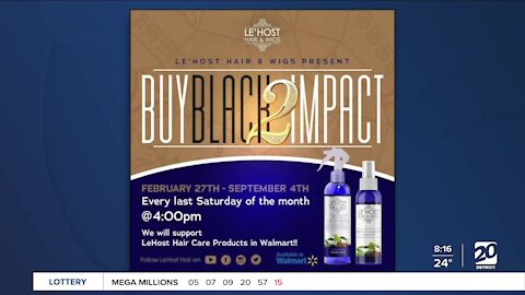 Local business owners holing Buy Black 2 Impact Our Community