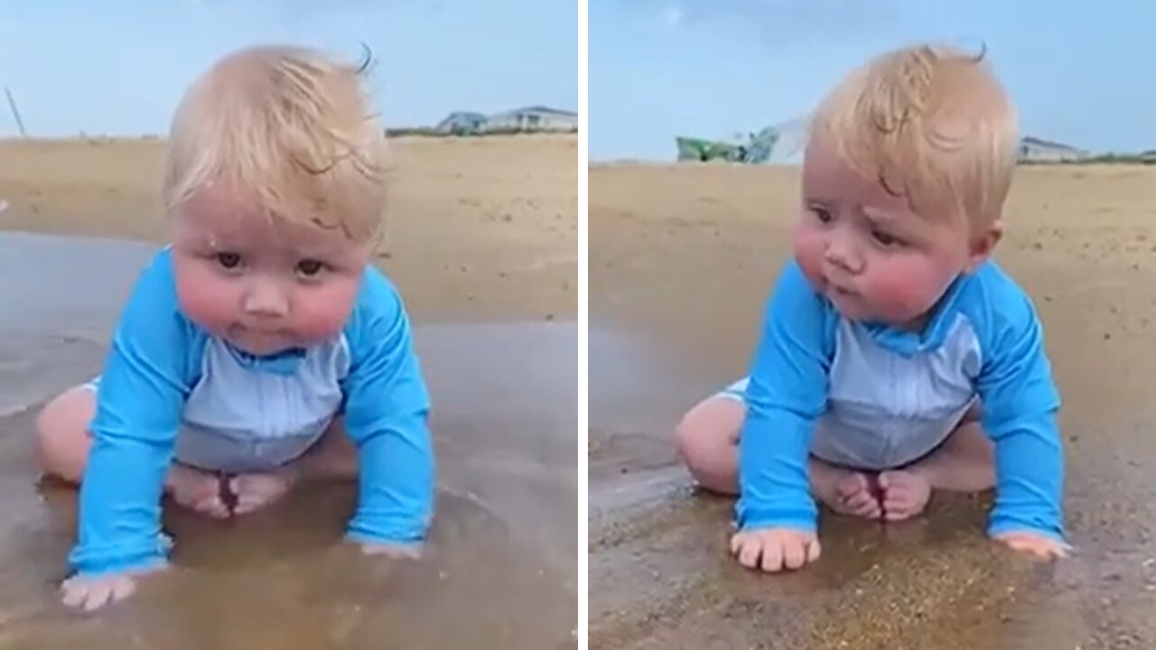 Cute Little Baby Boy Enjoys A Day At The Beach