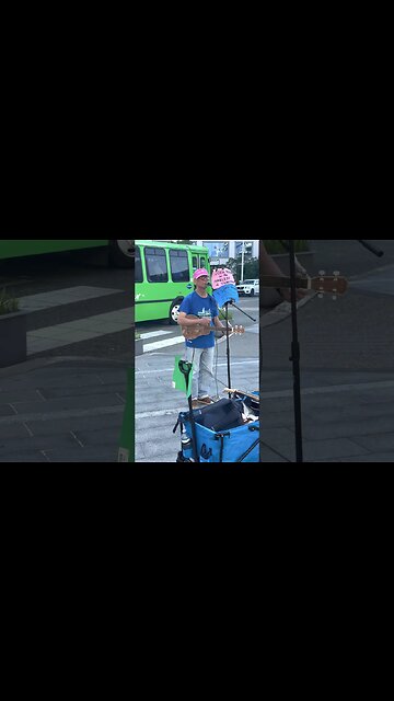 Busker playing music at Vancouver Convention Centre