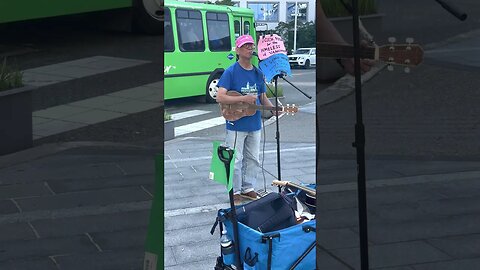 Busker playing music at Vancouver Convention Centre