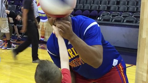 Boy Jumps For Joy After Harlem Globetrotter Teaches Him To Spin Basketball