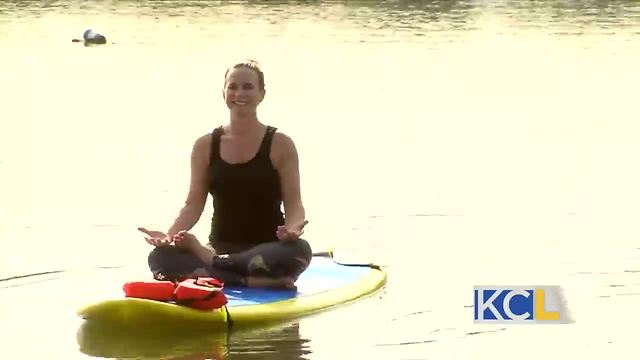 Michelle tries stand up paddle boarding yoga