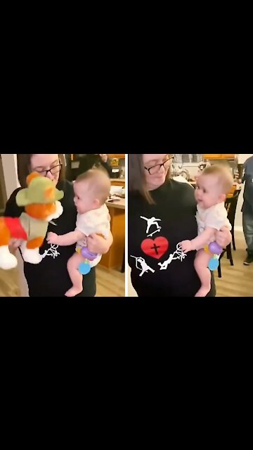 Cute Baby Laughs With Plush Dog