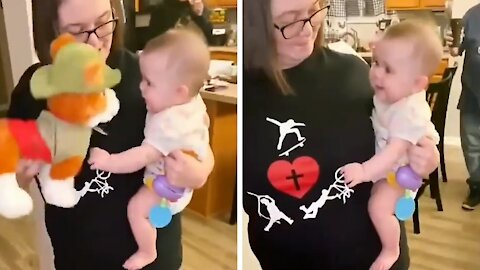 Cute Baby Laughs With Plush Dog