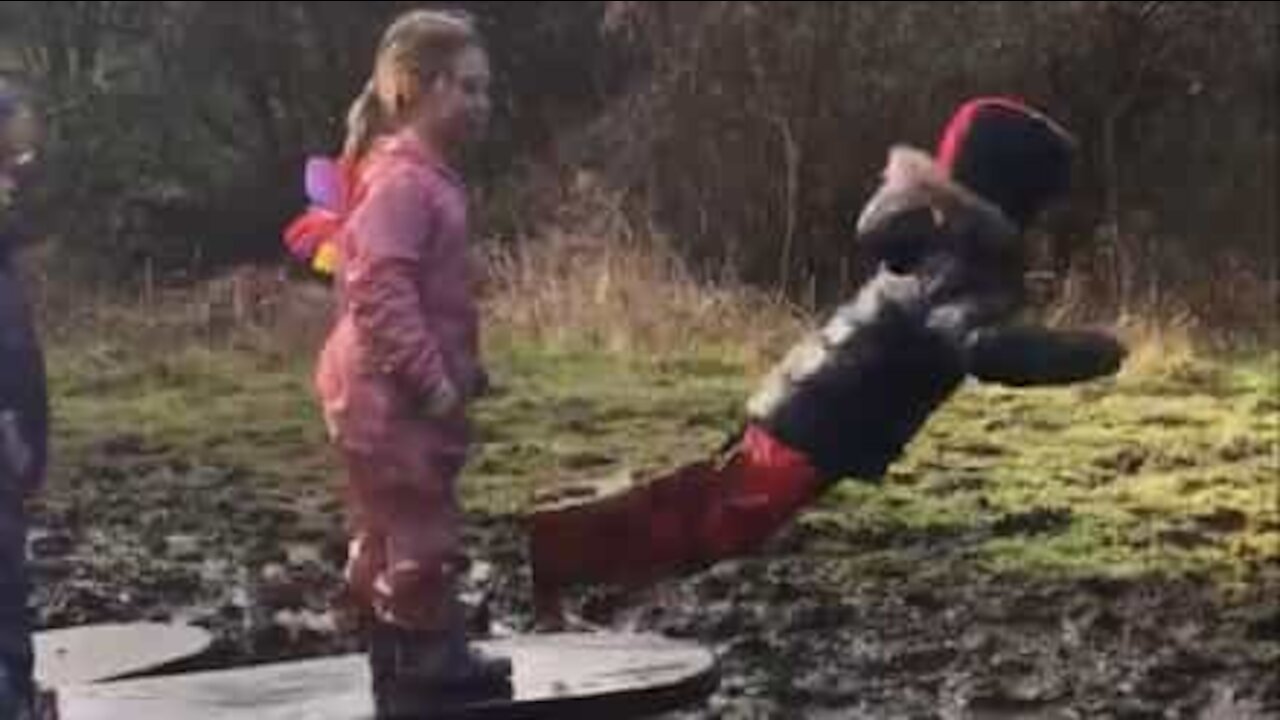 Boy falls face-first in puddle of mud!