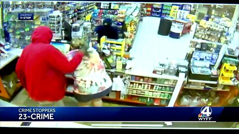 A white pregnant store clerk was beaten during violent armed robbery by two black gunmen