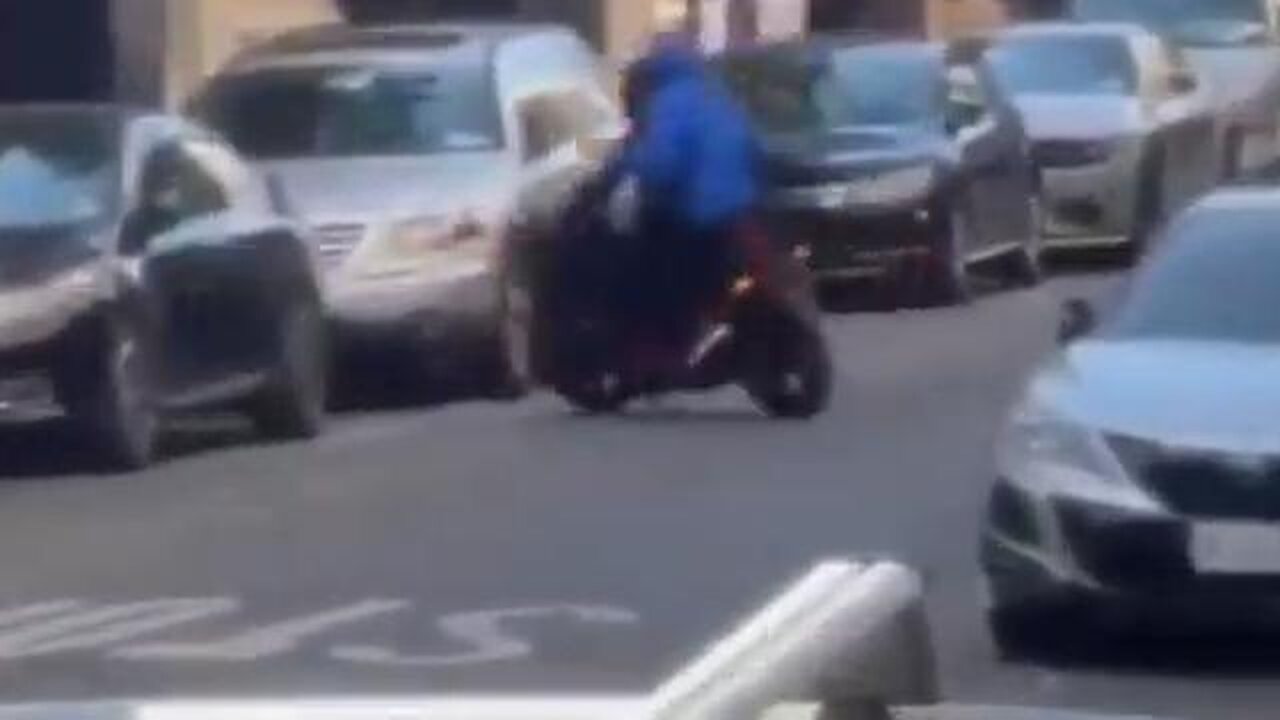 Two hooded black brothers on a motorcycle robbing locals in New York City USA...