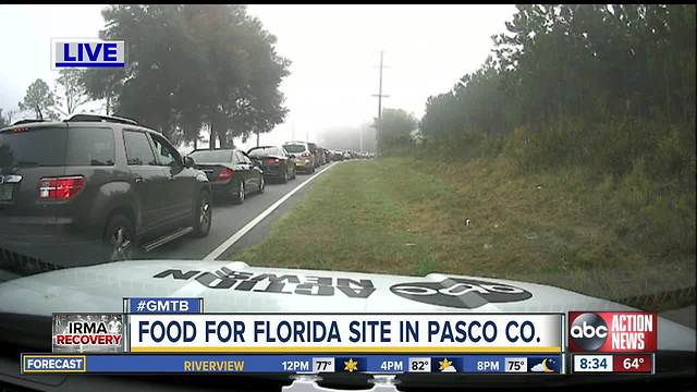 Familiar long lines string around Pasco fairground for disaster food program