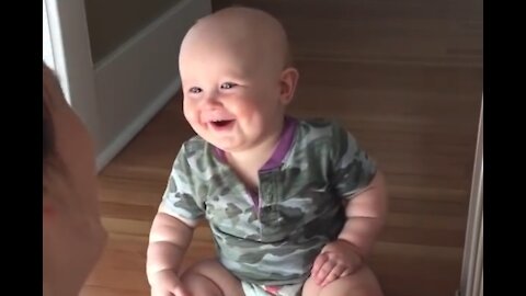 Baby laughing hysterically at mom's sunglasses trick