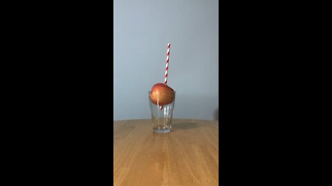 Putting A Straw Through An Apple