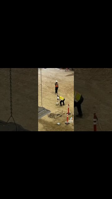 Worker stabs a propane tank with a rod