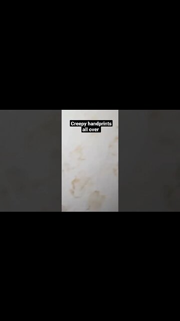 Baby handprints all over abandoned haunted house.