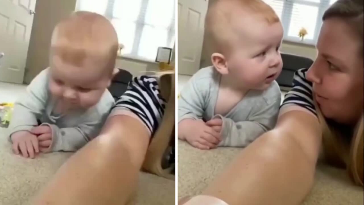 Baby making his funny face when accidentally collide with mom when playing