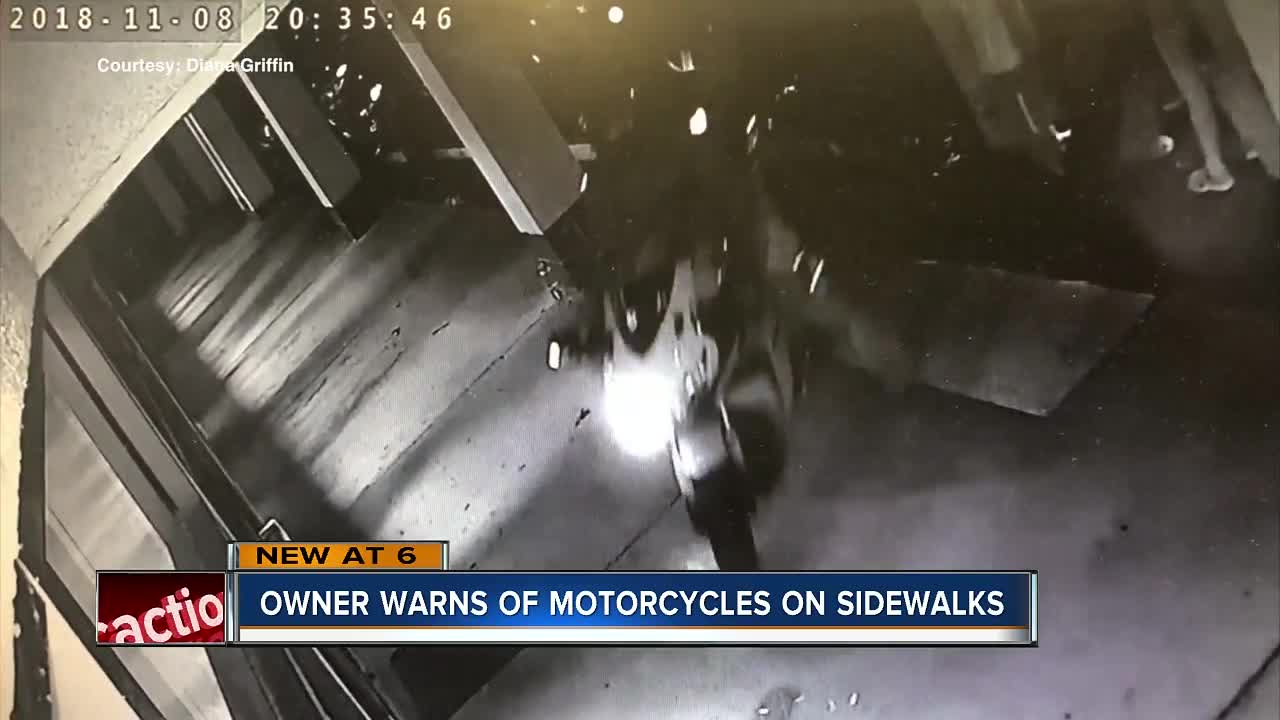 Motorcyclists riding on sidewalk at Palm Harbor strip mall