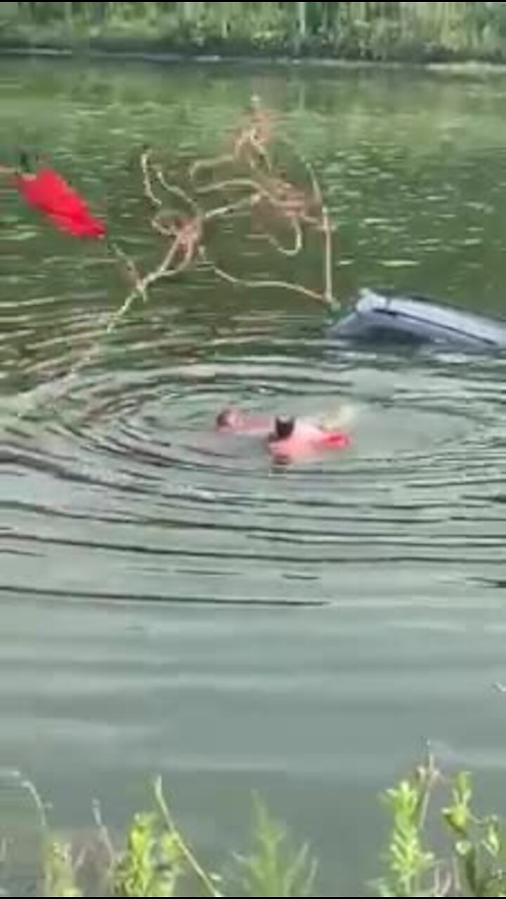 Rescue swimmers save driver from sinking car