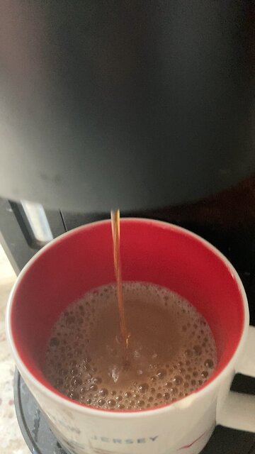 Keurig coffee cup being filled