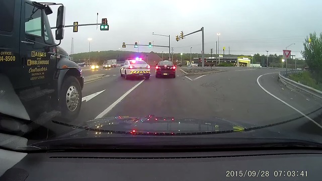 Truck Runs A Red Light In Front Of Cops And Gets Instant Karma