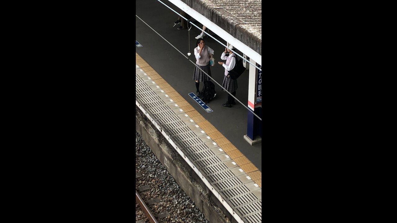 Train rolling into Ranzan station in Japan