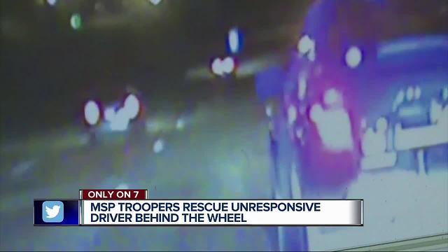 Michigan State Troopers hailed as heroes for saving woman overdosed behind moving vehicle