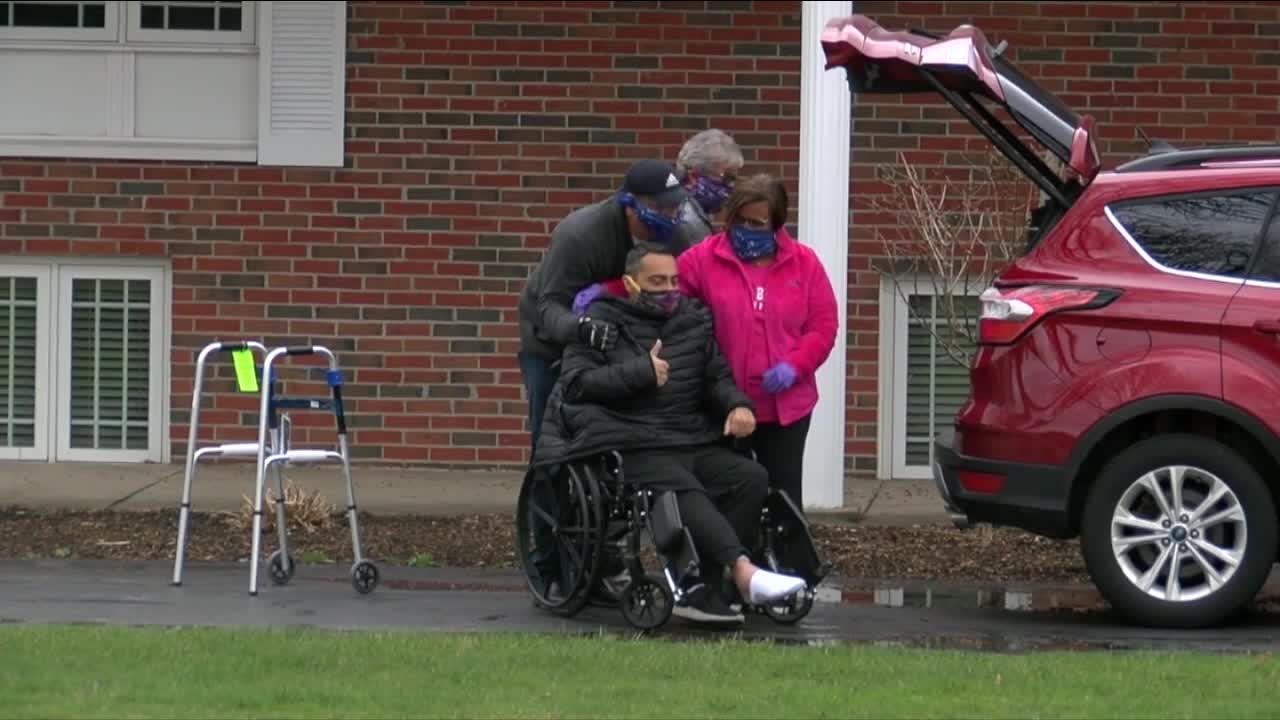 Family & friends welcome home father who had emergency heart surgery