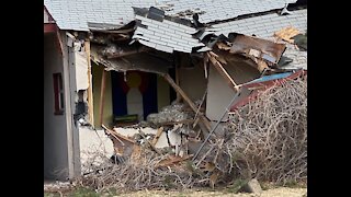 Trash truck crashes into Englewood home, causing partial collapse