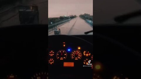 POV semi truck driver in thunderstorm