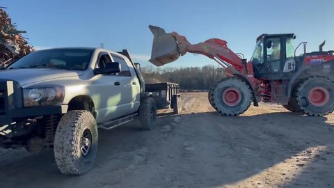 Hauling crushed concrete for pole building base.