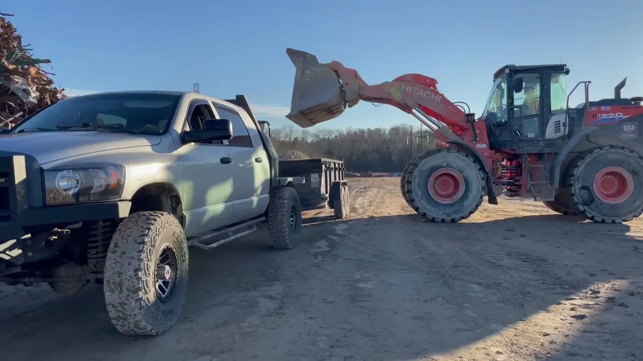 Hauling crushed concrete for pole building base.