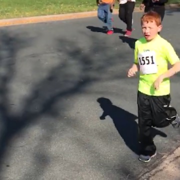 A Little Boy Stops To Hug His Mom During A Race