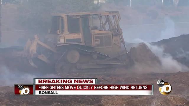 Firefighters move quickly before high wind returns