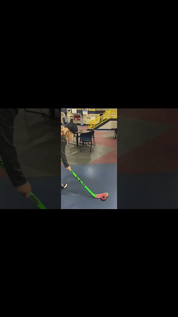 Hockey Kid Performs Stick Trick