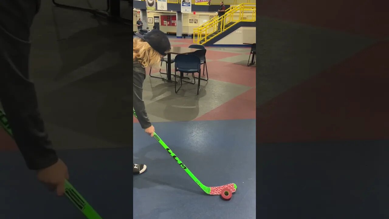 Hockey Kid Performs Stick Trick