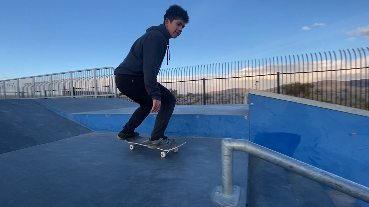 Boardsliding tiny rails. Father and son skate session.