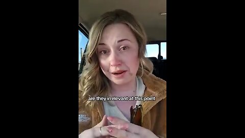 A woman breaks down after being told by nurses that her mask is ineffective in providing protection.