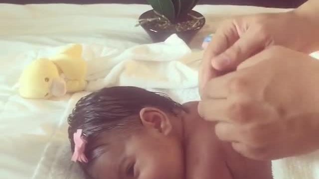 Newborn Baby Enjoys Relaxing Massage