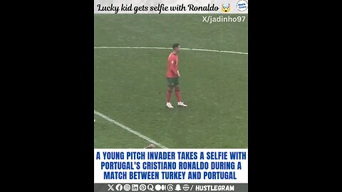 A young invader takes a selfie with Cristiano Ronaldo during a match between Turkey and Portugal