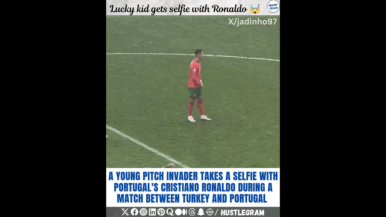 A young invader takes a selfie with Cristiano Ronaldo during a match between Turkey and Portugal