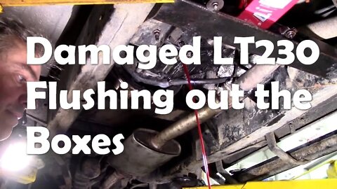 Damaged LT230. Replacement box is on, flushing the transmissions - a long messy job, but worth it!