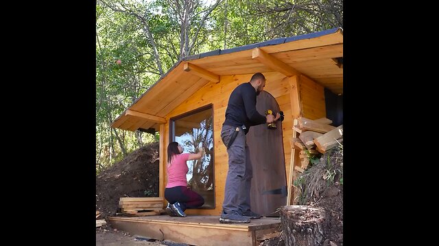 log cabins during a thunderstorm I build and live in wooden Hut in forest.