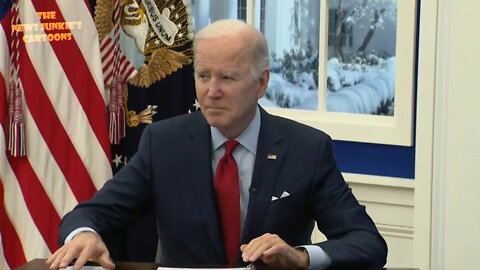 Biden again simply stares ahead while reporters ask him questions.
