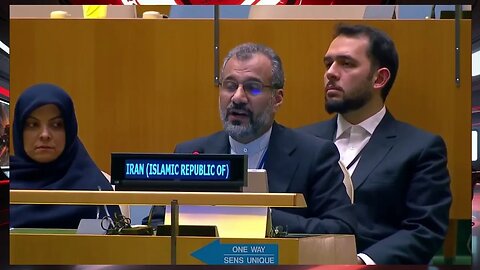 A representative for Iran makes a statement after the vote on the Gaza resolution