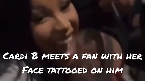 Cardi B signs a fan's leg with her face tattooed on it