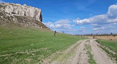Ukrainian Mil Mi-8 "Hip" fly at low altitude; both aircraft have LAU-61 suspended units for Hydra 70