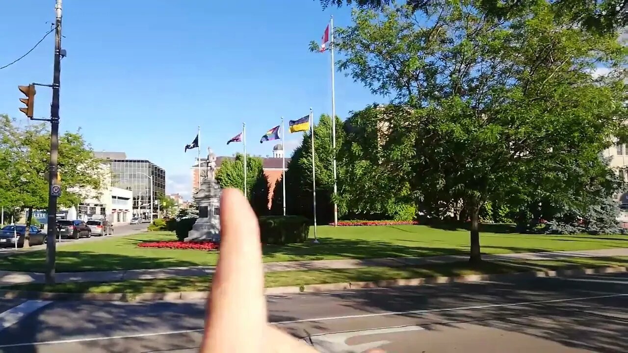 Please explain to me WHAT THESE FLAGS are doing at MY CITY HALL?