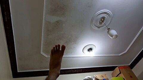 touching roof top light from bed