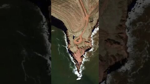 View of cliffs and waves from above