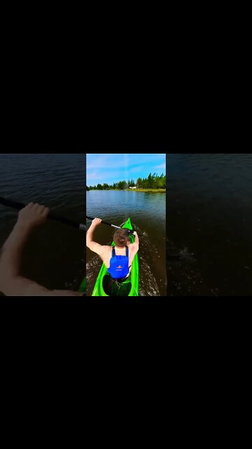 Kayaking fast through a river