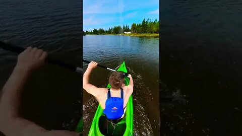 Kayaking fast through a river