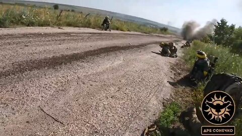 Ukrainian soldiers retreat after coming under fire from Russian forces in the Zaporizhzhia region